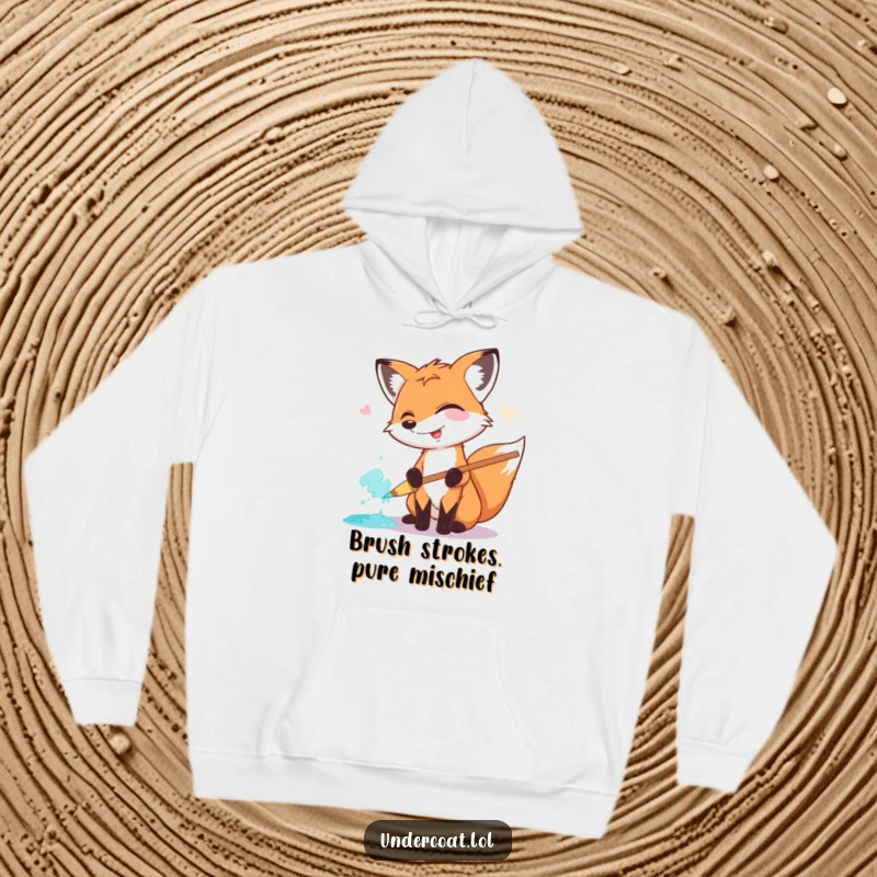 Funny Fox Painter Hoodie: A happy, giggling fox artist enthusiastically smears paint with a giant pastel brush, radiating warmth and humor.