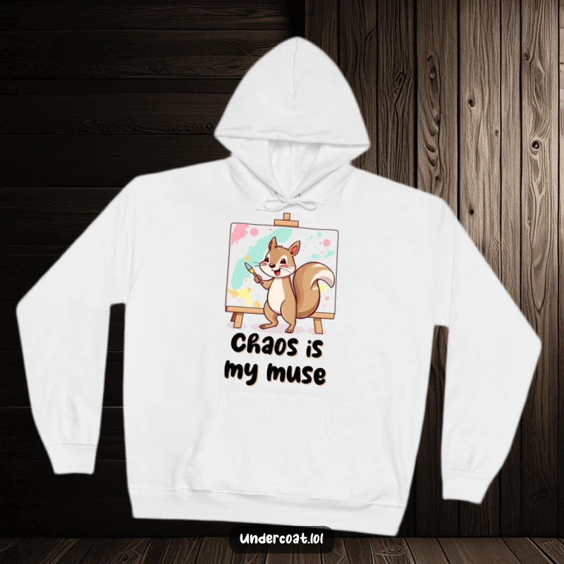 Funny squirrel hoodie with a cheerful squirrel vigorously painting a large abstract canvas, ideal for a cozy art session.