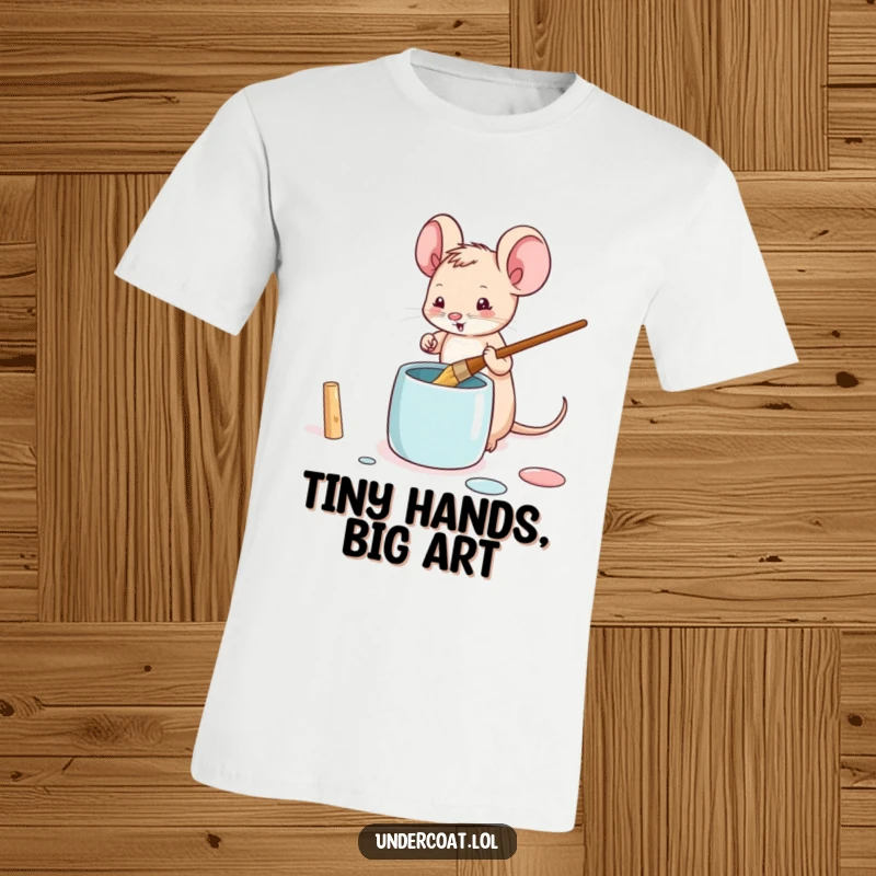 Funny mouse t-shirt featuring a tiny mouse playfully dipping a brush into a paint pot, ideal for art lovers.